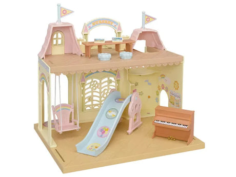 Sylvanian Families Baby Castle Nursery playset with slide, swing, piano, and detailed castle design in Ireland.