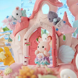 Sylvanian Families Baby Mermaid Castle shown close up with small animal figures at the front door