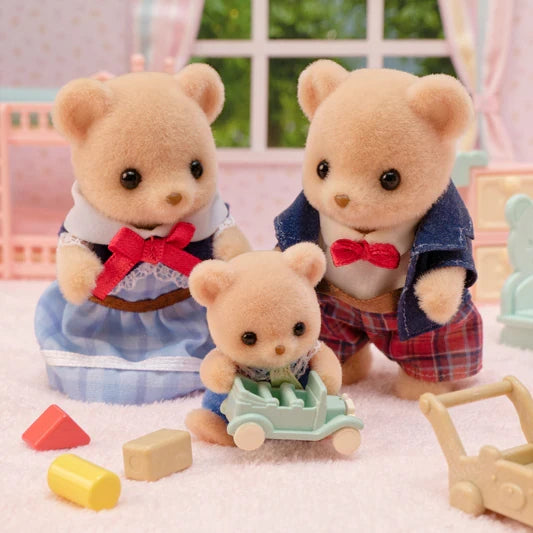 Biscuit Bear figures shown in a playroom scene with a toy car, blocks and furniture