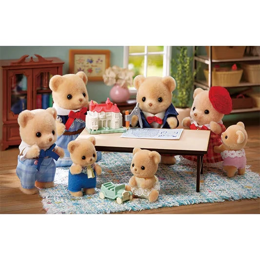Biscuit Bear figures shown in a room scene with a table, model house and toy car