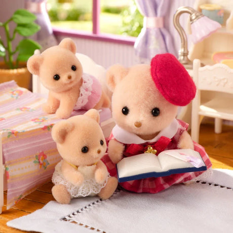 Biscuit Bear figures shown in a bedroom scene with a red beret figure and open book