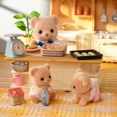 Biscuit Bear figures shown in a kitchen scene with a blue tricycle and small accessories