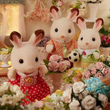 Chocolate Rabbit figures shown close up with flowers around them