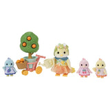 Four Citrus Bird figures shown with a fruit tree in a flowerpot and small cart on a white background