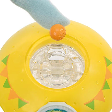 Close-up of the yellow juice stand top with an orange piece above a clear opening
