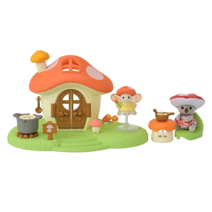 Sylvanian Families Fairy Mushroom House playset with its large red mushroom roof, miniature characters and accessories arranged on a white background.