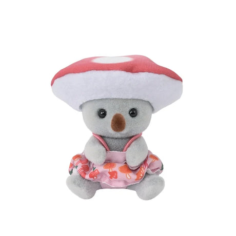Sylvanian Families character wearing a mushroom costume with a broad red cap, displayed against a white background.