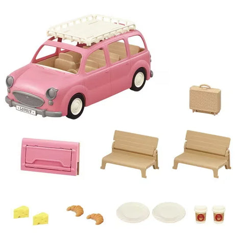 Pink Family Picnic Van with seats, basket, food, drinks, and picnic accessories arranged beside the car in Ireland.