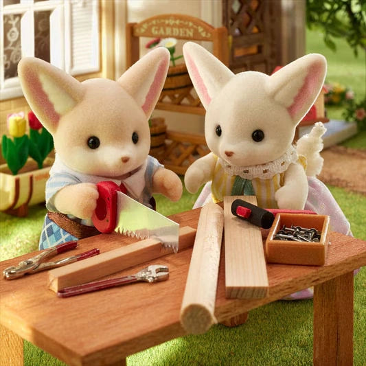Sylvanian Families Fennec Fox Family promotional photograph with warm interior colours.