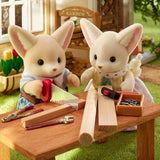 Sylvanian Families Fennec Fox Family promotional photograph with warm interior colours.