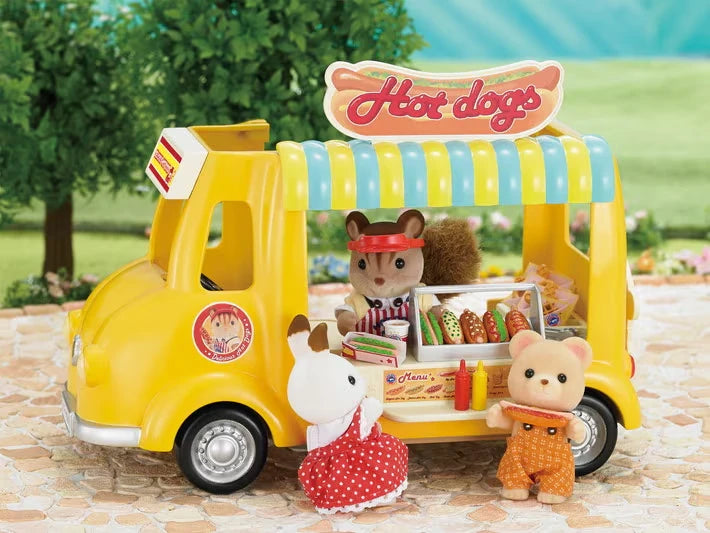 Sylvanian Families Hot Dog Van shown with three animal figures at the serving counter