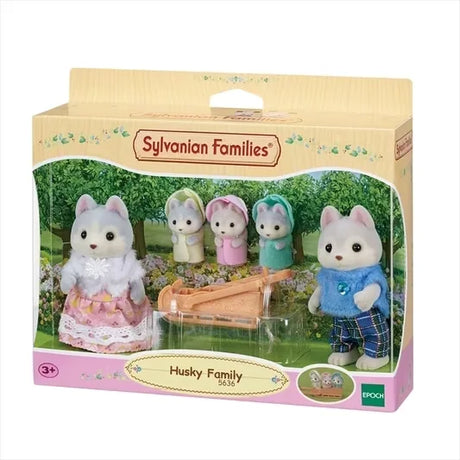 Sylvanian Families Husky Family packaging showing father, mother, triplets, and sleigh against garden backdrop in Ireland.