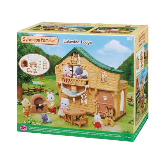 Sylvanian Families Lakeside Lodge 5451 retail packaging featuring the green roofed log cabin, animal figures, hammock and miniature furniture.