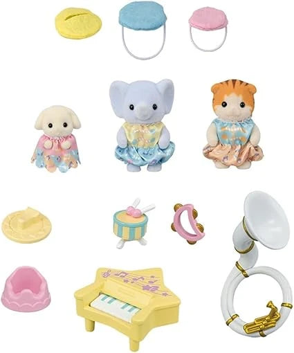 Three Sylvanian Families baby figures arranged with a star shaped piano, tambourine, drum with sticks and a sousaphone shown together on a white background