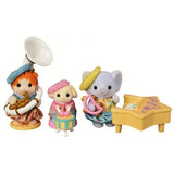 Three Sylvanian Families baby figures displayed with musical instruments including a white and gold sousaphone, small drum with sticks, tambourine and a yellow star shaped piano