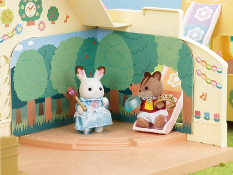 Play scene of Sylvanian Families Nursery Princess Play Set with castle and woodland stage backgrounds in Ireland.