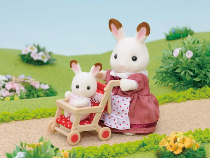 Sylvanian Families rabbit figures with red pushchair on village path