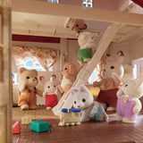 Close-up inside the Sylvanian Families house with animal figures, ladder and attic area visible