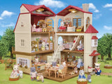 Open Sylvanian Families Red Roof Country Home shown from the front with animal figures and furniture