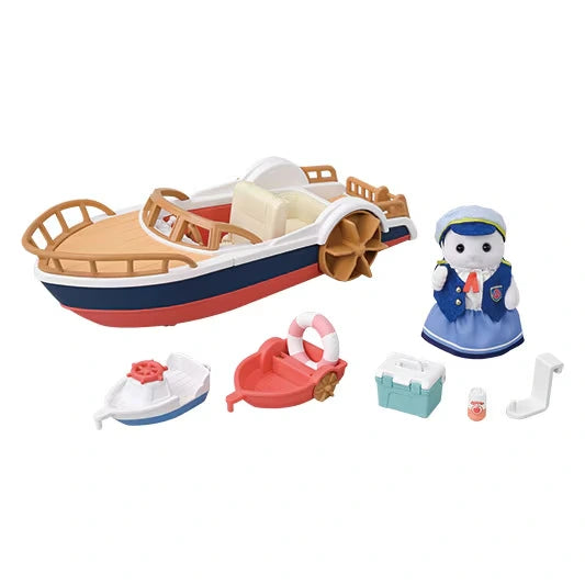 Sylvanian Families Seal Sailor's Leisure Boat set laid out on a white background with blue and red boat, seal mother figure in blue, two miniature boats, swimming ring, cool box, bottle and attachment piece.