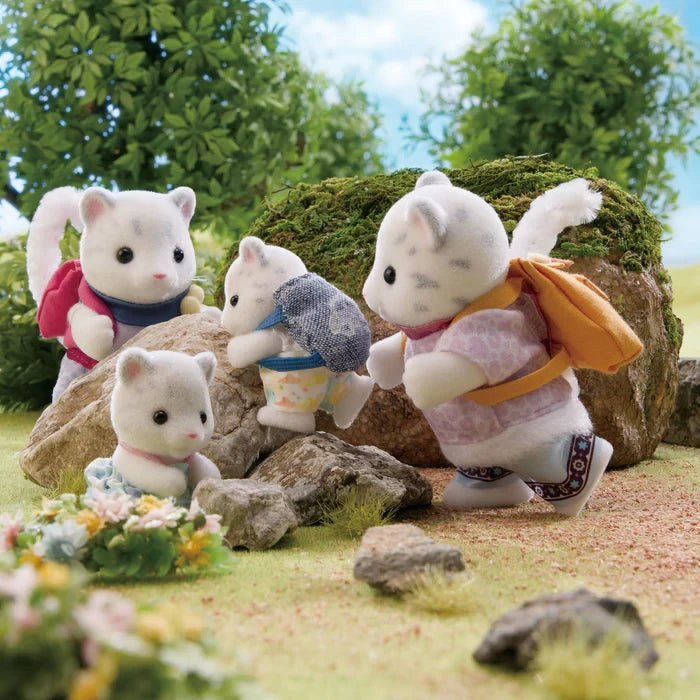 Snow Leopard figures shown outdoors with a baby snowmobile, skis and a backpack