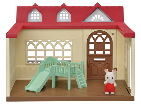 Interior of Sweet Raspberry Home with Chocolate Rabbit Baby in green slide bed beside window and open door in Ireland.