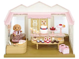 Inside view of Sylvanian Families Village Cake Shop showing cakes, pastries, and Toy Poodle Mother in Ireland.