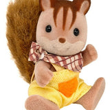 Seated squirrel figure in yellow outfit shown close up