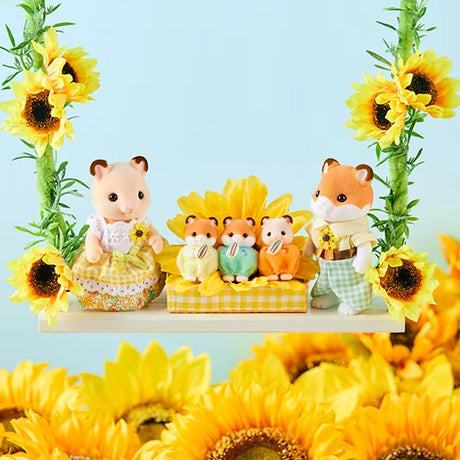 Sylvanian Families Hamster Family with three babies sitting on a yellow checked platform between their parents, surrounded by large yellow sunflowers.