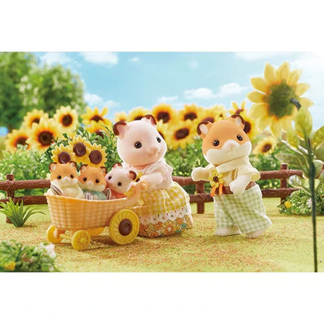 Sylvanian Families hamster parents beside a wicker style baby carriage holding three baby hamsters, with sunflowers and a wooden fence in the background.