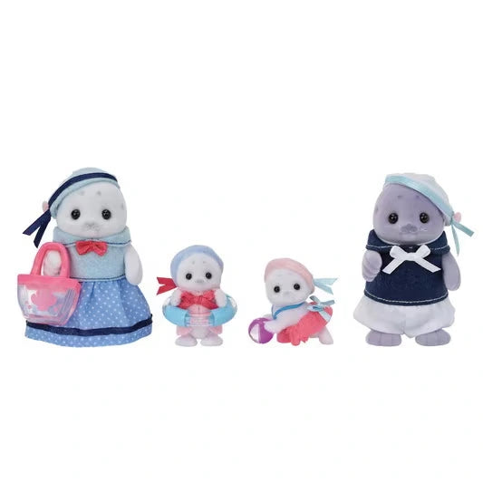 Sylvanian Families Seal Family featuring two parent seals and two baby seals in blue and pink seaside outfits, with the mother holding a pink beach bag, against a white background.