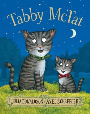 Tabby McTat book cover showing two cats with bows sitting under the moonlit night sky in Ireland