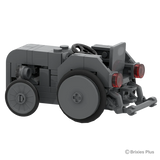 Rear three quarter view of the Massey Ferguson TEA 20 Mini showing the red rear lights, steering wheel, large rear tyre and rear linkage