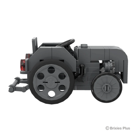 Massey Ferguson TEA 20 Mini BRIXIES model in full side profile facing right with the steering wheel, grey body and rear hitch visible
