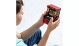 Child holding and playing the Tetris Classics Retro Mini Arcade Machine with both hands, showing the compact size of the red cabinet with colour screen displaying Tetris gameplay