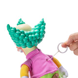 Hand pulling the string on the back of The Simpsons Talking Krusty Doll