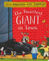 Front facing view of The Smartest Giant in Town board book showing characters beside a red brick wall
