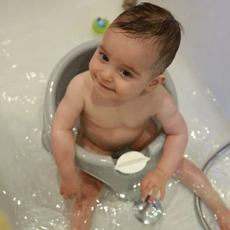 Thermobaby Aquafun Bath Seat Green with baby seated in bathtub