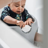 Thermobaby Aquafun Bath Seat with baby using the front watermill