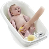 Thermobaby Babycoon Powder Pink Bath Seat shown supporting a baby during bath time