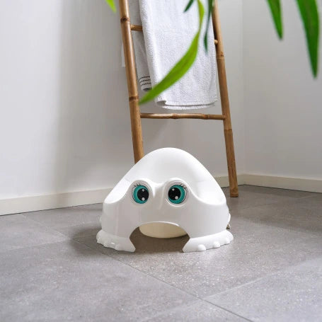 Thermobaby Funny Potty Mix white potty shown on a bathroom floor with face detail