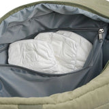 Thermobaby Pluméa Cactus Green changing bag interior with grey zip pocket and nappies stored inside.