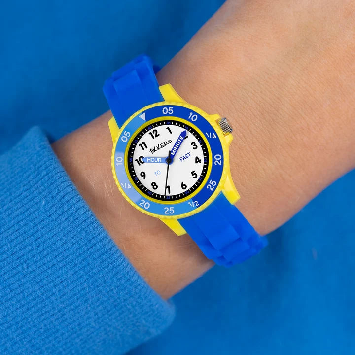 Tikkers Blue Silicone Time Teacher Watch worn on the wrist with blue silicone strap and yellow case