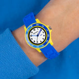Tikkers Blue Silicone Time Teacher Watch worn on the wrist with blue silicone strap and yellow case