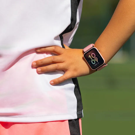 Tikkers Series 13 Pink Riptape Smart Watch worn on the wrist with pink fabric strap and colour touchscreen display