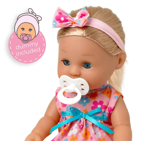 Close view of the Tiny Tears Classic doll with long blonde hair, floral headband and white dummy in her mouth