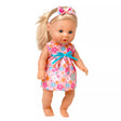 Tiny Tears Classic doll standing in a pink floral dress with blue ribbon, long blonde hair in a ponytail and pink floral headband