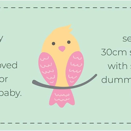 Close view of the Tiny Tears packaging artwork showing a yellow and pink bird illustration on a pale green panel with partial product text visible at the sides