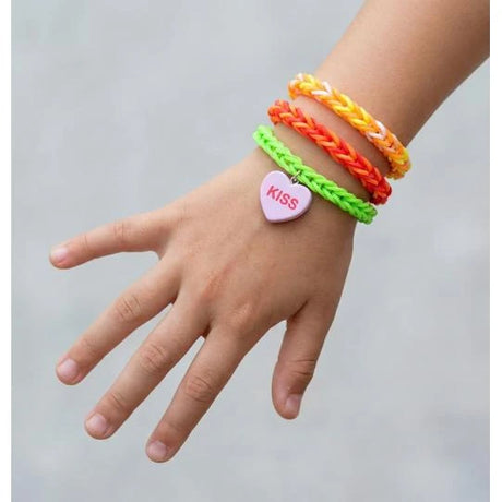 TOPModel loom band bracelets on a wrist with a pink KISS charm