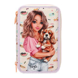 Front of the TOPModel SUNNY DOG pencil case with an illustrated girl holding a dog against a small dog print background.